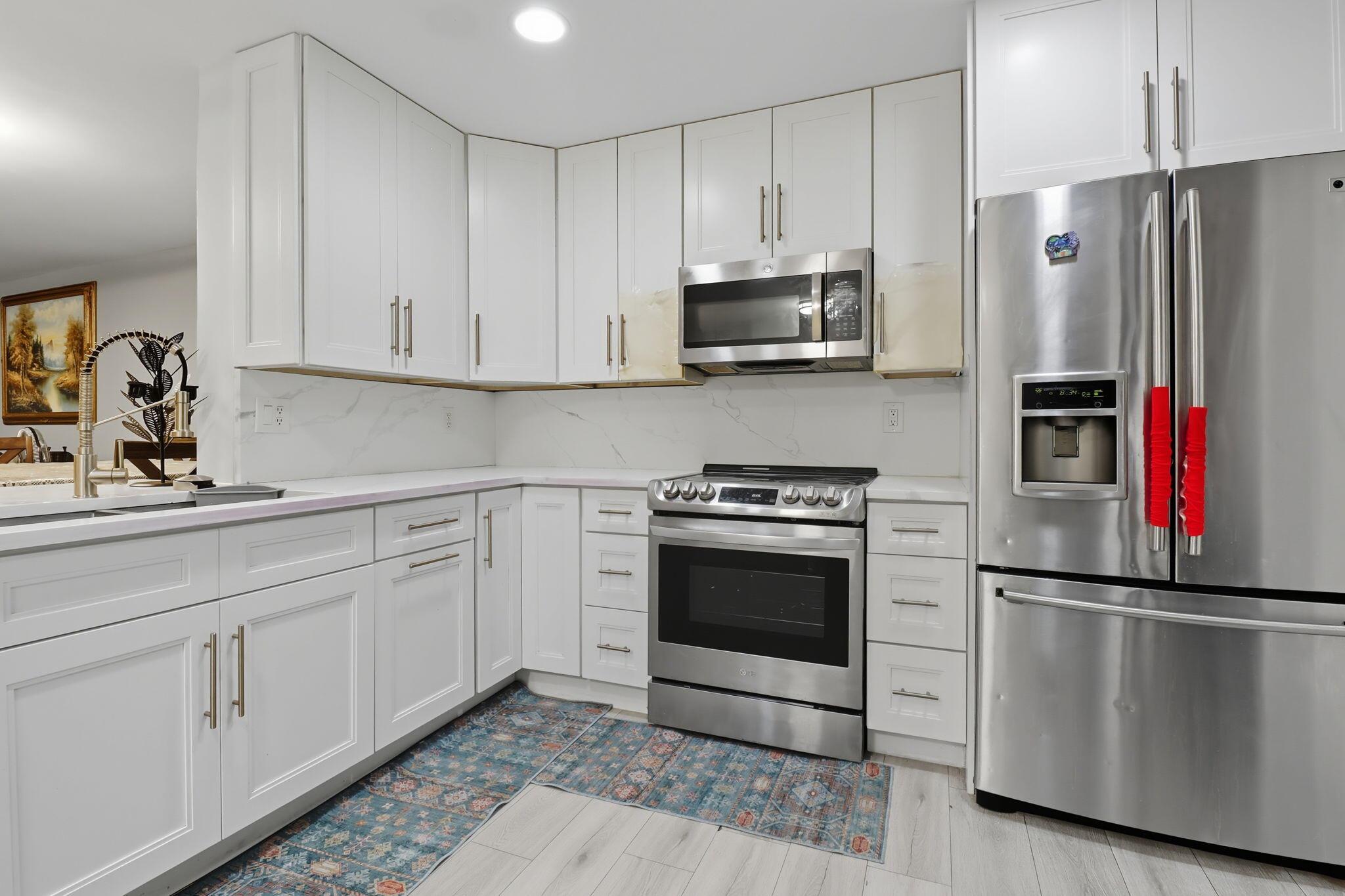 Beautifully upgraded home in a kid-friendly neighborhood. New roof, new AC, remodeled kitchen & bathroom, plus wood floors throughout. Spacious 3 bedrooms / 2.5 baths, full of natural light. Enjoy being just under a mile from Diamond View Elementary, Tradewinds Middle, and Santaluces High Schools. Grocery shopping and restaurants are close by. Easy access to I-95 for commuting. Plus large parks like Okeeheelee within a short drive, offering trails, sports courts & playgrounds. Perfect blend of comfort & convenience.