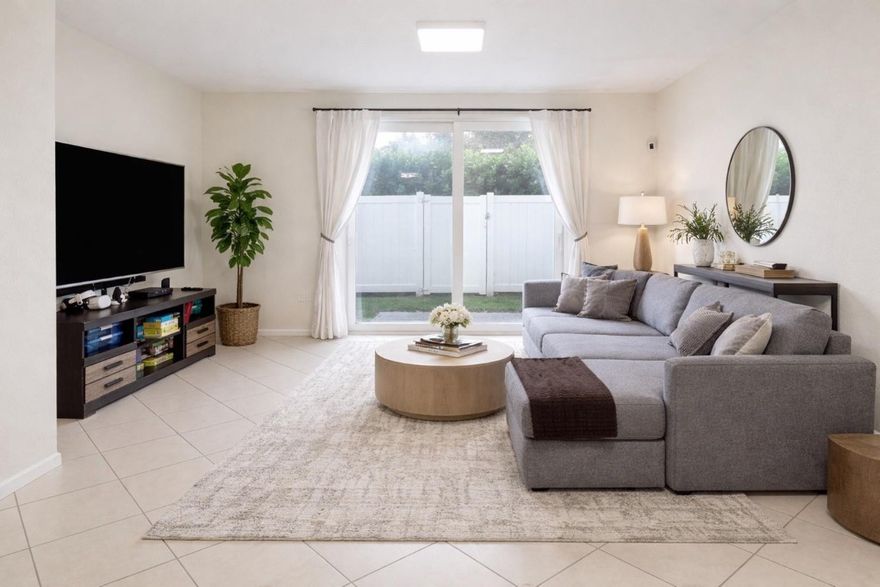 Hurricane Impact windows, brand-new 2024 A/C unit, New 2023 Tankless water heater and a fenced backyard for added privacy. Updated 3-bedroom, 2.5-bath townhouse featuring a Jack-and-Jill bathroom setup, upstairs laundry,  This stunning home offers low HOA fees covers cable and wifi! and is conveniently located near major highways, shopping, and dining—perfect for comfort and convenience.