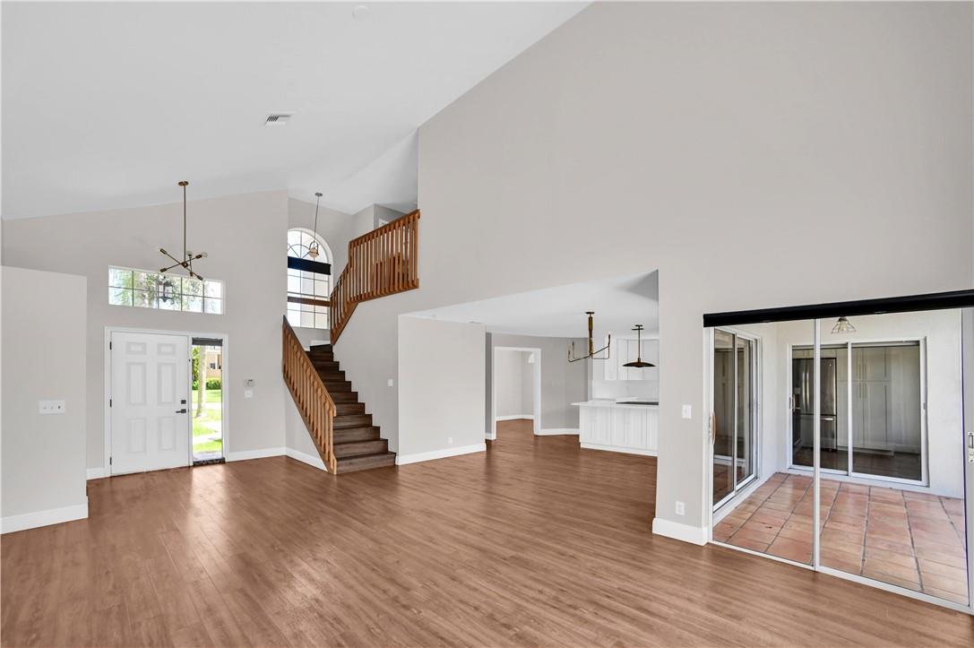 Beautifully appointed 2 story home in Parkland featuring naturally bright living areas with a spectacular lake view. Spacious open floor plan with vaulted ceilings and hard floors throughout. Downstairs room can be used as an office. New insulated garage door in climate controlled garage. This home is in a beautiful community with quick access to major roads, all things shopping, dining and more. Community pool. Rapid Approval.