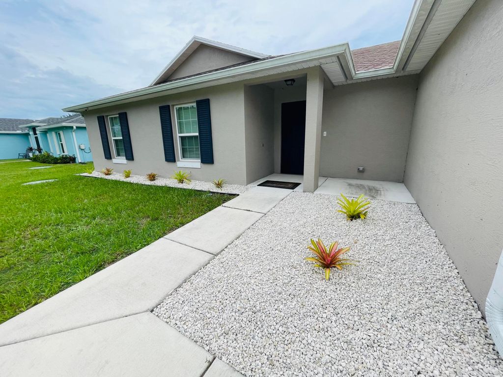 Photo of 3631 SW Kromrey Street, Port Saint Lucie, FL 34953 (MLS # B26015337)