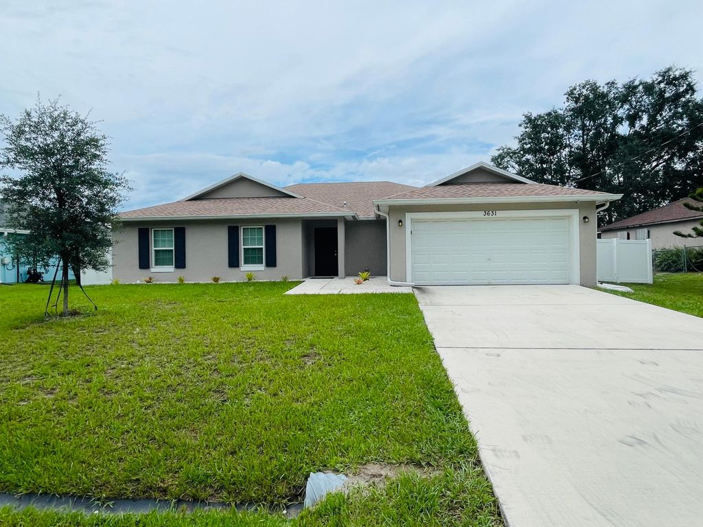 Photo of 3631 SW Kromrey Street, Port Saint Lucie, FL 34953 (MLS # B26015337)