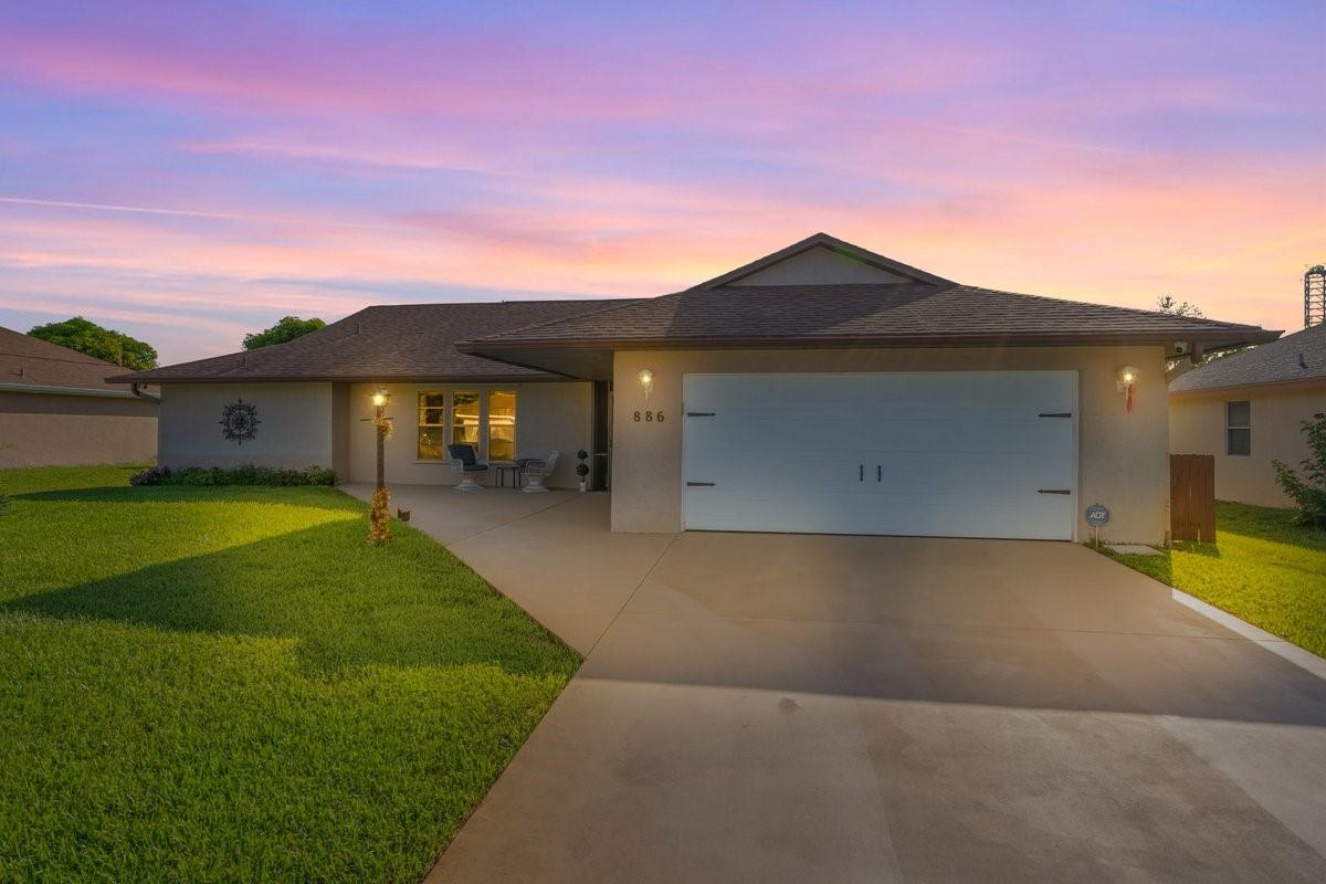 Welcome to this well-maintained 3-bedroom, 2-bathroom home featuring a desirable split floor plan and a spacious 2-car garage. Designed for comfort and privacy, the interior offers newer flooring, fresh paint, and vaulted ceilings with recessed lighting that creates a bright, open feel. The A/C was replaced in 2019, and the home includes complete hurricane shutters and upgraded rain gutters for added peace of mind. Located in a prime area with easy access to both St. Lucie West and US1—and no HOA—this property delivers flexibility, functionality, and exceptional value. Don’t miss out on this fantastic opportunity!