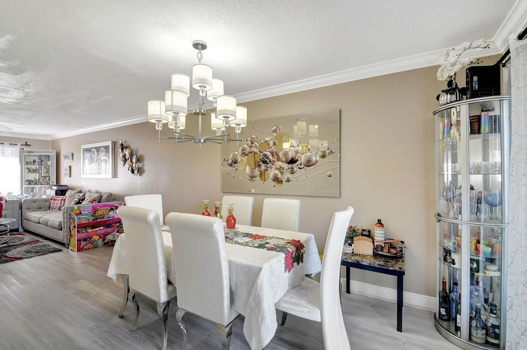 Photo of 3003 Poolside Drive, Greenacres, FL 33463 (MLS # R11126878)