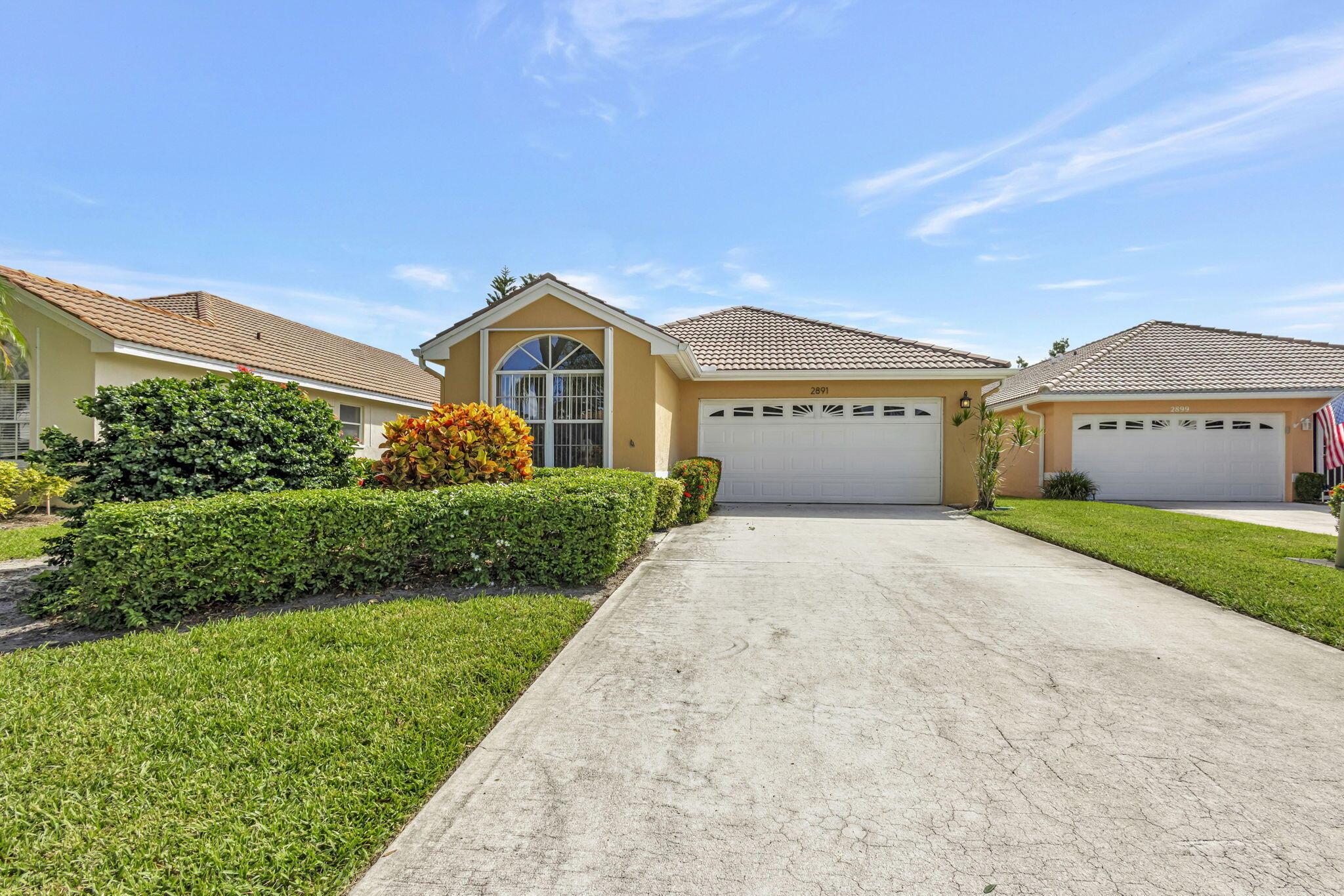 Live the Florida lifestyle in The Charter Club--one of Palm City's best value communities! This meticulously maintained home features vaulted ceilings, an open and airy layout, and abundant natural light throughout. The split-bedroom floor plan ensures privacy, while the large screened patio overlooks peaceful lake views--perfect for relaxing or entertaining.A two-car garage with attic provides for extra storage, with a new AC installed just last year. This property offers an assumable mortgage at a low interest rate--a rare opportunity for today's buyer. Zoned for A-rated schools, The Charter Club offers resort-style amenities in a gated community. Golf and tennis memberships available in nearby communities. Conveniently located minutes from downtown Stuart, the beaches and commuting.