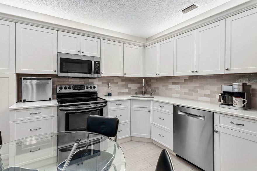 Beautiful first-floor lake view condo located in the desirable gated Platina community in Boynton Beach. This well-maintained home features a renovated kitchen and updated bathrooms, with peaceful lake views visible from every room. The bright layout offers comfortable living and a relaxing setting to enjoy the water views year-round.  Platina is an all-ages community with a 24-hour guarded entry and a newly renovated clubhouse featuring a state-of-the-art fitness center, performance center, poker and card rooms, billiards room, ceramics studio with kiln, solarium, and café. Residents enjoy four heated/cooled pools, tennis, pickleball, bocce, shuffleboard, BBQ areas, and over 30 clubs and social activities. Fiber optic service provides high-speed internet, WiFi, and cable TV.  Platina Community Amenities & Clubhouse Features  • 24-hour guard-gated community with beautifully maintained grounds • Recently renovated clubhouse and social center • State-of-the-art fitness center / gym • Performance center featuring year-round professional entertainment • Card rooms, poker room, and billiards / pool room • Ceramics studio with kiln • Computer club and meeting rooms • Indoor and outdoor café areas • Solarium and lounge areas for social gatherings • Four heated/cooled swimming pools • Tennis courts and pickleball courts • Bocce and shuffleboard courts • Outdoor BBQ areas • Over 30 resident clubs and social activities including aerobics, aquacise, tennis, golf groups, cards, and hobby clubs • Active evening social calendar and community events • Special seasonal activities for visiting grandchildren • Fiber optic service providing high-speed internet, WiFi, and bulk cable TV (including HBO) • WiFi access available at clubhouse and pool areas