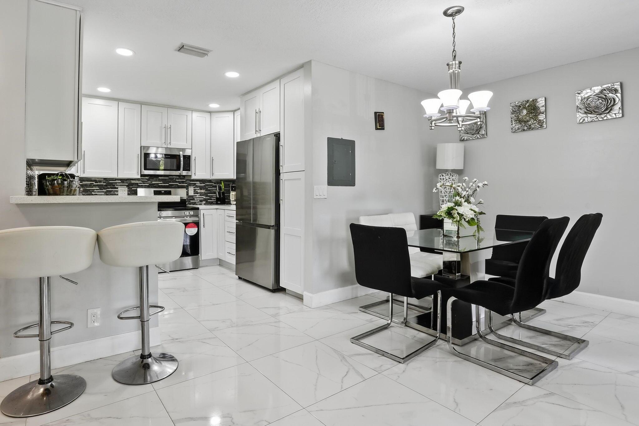 Step into modern comfort with this newly updated 3-bedroom, 2 bath condo that blends style and functionality. Featuring an open-concept layout, the living and dining areas flow seamlessly, perfect for both entertaining and everyday living. The UPDATED kitchen offers sleek quartz countertops, 2024 refrigerator, Stove- 2 mos, 2019 dishwasher/microwave, all stainless steel, and ample cabinet space.The spacious primary suite includes a private bath, a BRAND NEW vanity, with a generous walk in closet, while two additional bedrooms provide flexibility for guests, a home office, or a growing family. Both bathrooms have been tastefully refreshed with contemporary finishes.Additional highlights include new tile flooring, fresh paint, and plenty of natural light throughout.