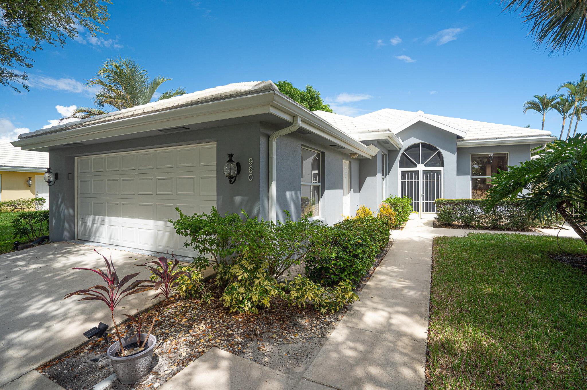 Stunning Views! Enjoy South Florida living in the sought-after gated community of Bear Island. This beautifully maintained single-story home sits on the golf course offering sweeping golf and lake views with beautiful sunrises. From the moment you enter, you're welcomed by an abundance of natural light, neutral tones, and spacious open-concept living and dining areas. Expansive Impact sliding doors seamlessly connect the indoor space to a serene backyard and patio, ideal for relaxing or entertaining against a stunning golf course backdrop. Live in one of Palm Beach's premier golf course communities without the burden of a mandatory membership fee. Bear Island is a 24-hour manned gated community, located within Village Lakes POA. This offers 3 separate parks with pools, tennis and more!