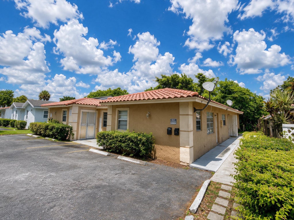 Photo of 4125 Woodside Drive #2, Coral Springs, FL 33065 (MLS # B26056574)