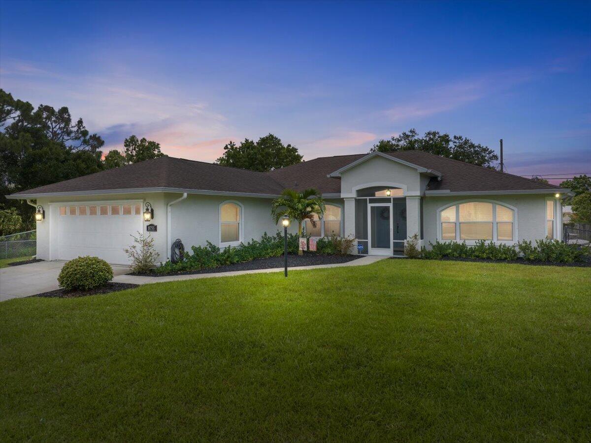 Beautifully Updated Pool Home on Double Lot with Room for All Your Toys! The updated kitchen features solid wood cabinetry, quartz countertops, and stainless appliances. New hurricane impact windows and doors, New A/C (2021), New water heater (2025), Newer roof (2018), New 96-ft well for the home (with softener system) and irrigation. New flooring in the main living areas and carpet in the bedrooms. The fully fenced backyard has a pool with paver patio that leads to the second driveway with water and electric hookup which is perfect for boat or RV, plus a 12x17 shed with a roll-down door. This home is a must see! It has so many upgrades and is move in ready!