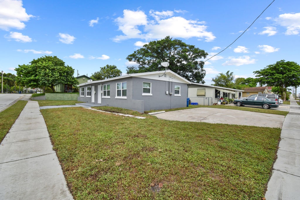 Photo of 968 W 9TH Street #A1, Riviera Beach, FL 33404 (MLS # B26062552)
