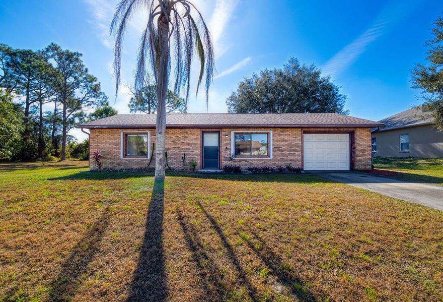 Well-maintained Palm Bay, FL home. Improvements include Roof (2016), A/C (2022), refrigerator (2022), oven (2023), microwave (2023), garage door opener (2024), accordion shutters (2024), portable dishwasher (2022), washer (2022), dryer (2019), and water heater (2018). Ring security devices installed front and back in 2020 and 2023. The home backs to a canal, offering added privacy. Fiber internet availability reported through 3Wire and AT&T, with Spectrum Cable also available. The adjacent lot is available for purchase, providing a potential opportunity for expansion or investment. Conveniently located approx. 9 minutes to I-95 and 6 minutes to Publix. Ideal for investors or first-time homebuyers.