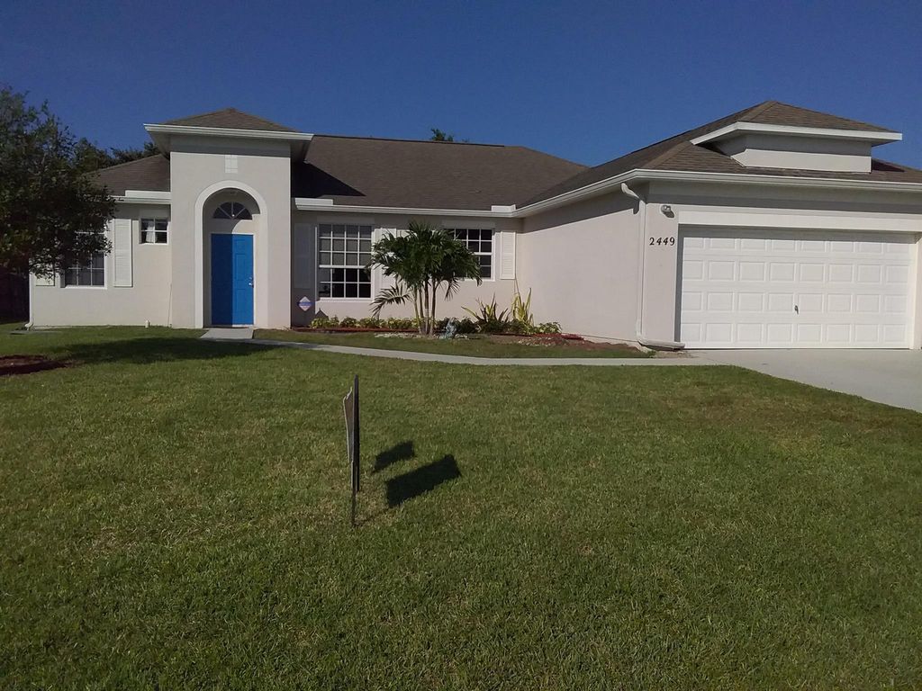 Photo of 2449 SE Camarin Street, Port Saint Lucie, FL 34952 (MLS # R10961453)