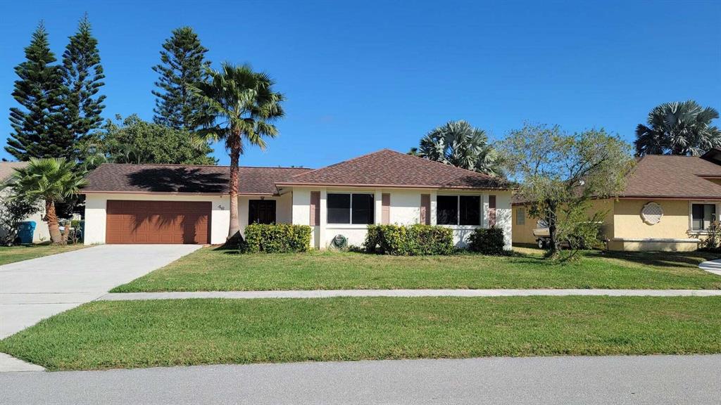 WATERFRONT PROPERTY FOR RENT! Enjoy the amazing waterfront view from the extra large back yard, and large screened in patio, in this beautiful, private, fully remodeled, 3br/2ba, one story, single family home, with a 2 car garage and an extra-long driveway, located at Dos Lagos, in Boynton Beach. This house has new Samsung kitchen appliances, and tile throughout kitchen, and living/family room. Washer and Dryer located in the garage. Listen to your favorite beats through the speaker system in the master bathroom. Bring your small boat, and jet skis, and cruise to lake Ida and lake Osbourne, right from your backyard. Lease includes cable and high speed internet.