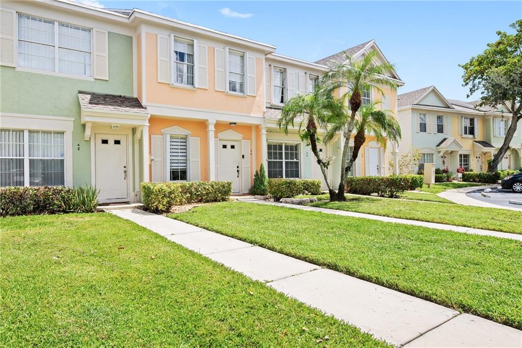 Rarely on the market! This Key West style and beautifully renovated 2 bedroom, 2.5 bath condominium located in the coveted Coconuts area of Weston. Ownership comes with membership to the Bonaventure Country Club. Features a completely updated kitchen with stainless steel appliances and pristine white cabinets showcase the ice-blue tile backsplash and pendant lights over the sink. The lower level is complete with a convenient half bath and the stacked washer and dryer. Exit the rear sliding glass door and find a cozy covered brick patio with water view. This home is pristine bright and super clean! MUST SEE!