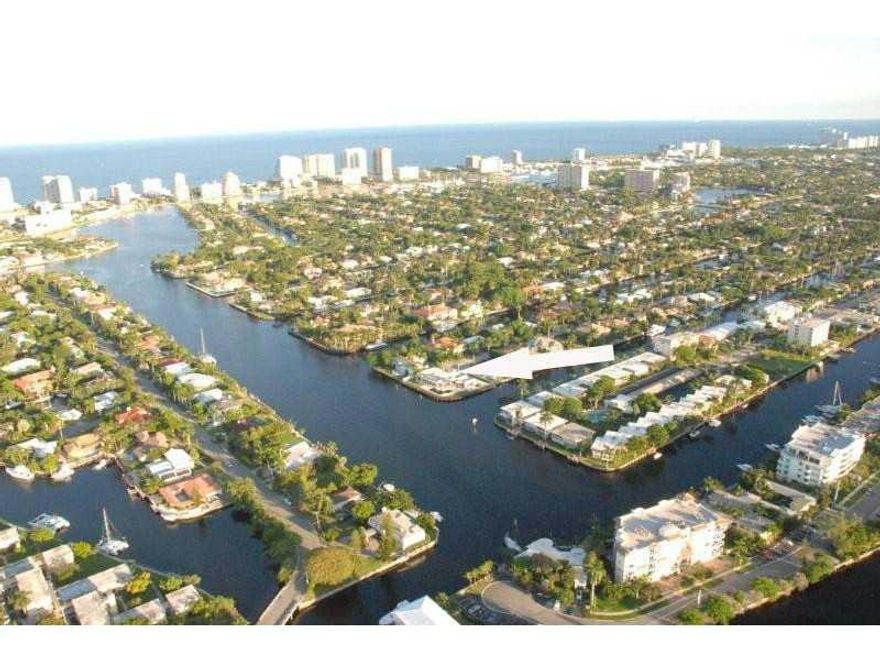 DOCK 168' VESSEL! PRESTIGEOUS LAS OLAS POINT LOT WITH 275' OF PRIME DOCKAGE FOR TWO MEGA YACHTS!   LOCATED ON 300' WIDE RIO BARCELONA RIVER, PROVIDES FOR SPECTACULAR PANORAMIC WATER VIEWS!  THE HOUSE IS 5 BED 4.5 BATH  LIVABLE TEAR DOWN THAT CAN BE TORN D OWN IMMEDIATLY OR BUILD NEW HOME OR LAND BANK AND CONTINUE TO RENT HOUSE AND 2 MASSIVE MEGA YACHT DOCKS FOR STRONG ANNUAL INCOME.  PRICED FOR LOT VALUE!  THE LAST TEAR DOWN POINT LOT AVAILABLE IN SOUTH EAST FORT LAUDERDALE!  COME BUILD YOUR DREAM!