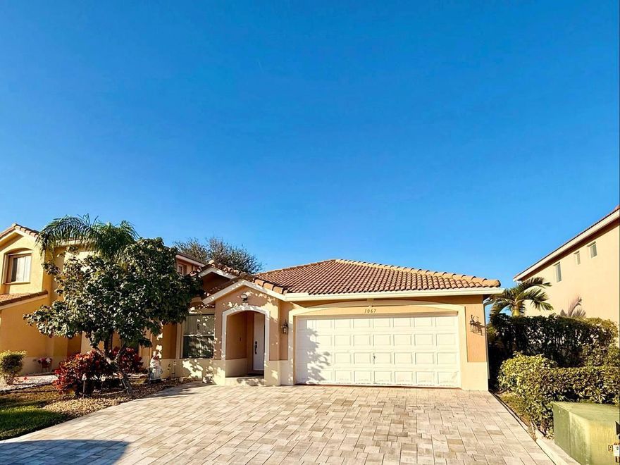 Price to sell. Beautiful and well-maintained 3-bedroom, 2-bathroom home located in the desirable Turtle Cay community in West Palm Beach, featuring serene lake views. This stunning residence offers remodeled kitchen cabinets and updated bathrooms, creating a bright and inviting living space. Recent upgrades include a water heater (2023), refrigerator (2023), dishwasher (2025), microwave and stove (2022), washer & dryer (2023), and a wide paved driveway (2023). Freshly painted inside/outside (2023). Equipped with a 4-ton Goodman AC system (2020). The home sits on an oversized premium lot, providing more outdoor space than standard lots. Community includes access to a pool, gym, tennis courts, playground, billiards room, tennis court and common areas. Move-in ready and exceptionally clean.