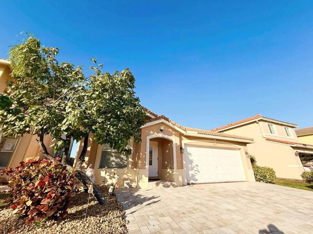 Photo of 1067 Big Torch Street, Riviera Beach, FL 33407 (MLS # R11157909)