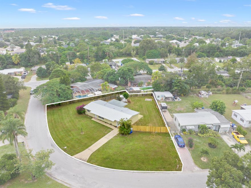 Discover the potential of this spacious 4-bedroom, 2-bath home, perfectly set on just under half acre lot. Featuring a new metal roof (2024), hot water heater (2023) and AC (2018), this property offers lasting durability and peace of mind from day one. The expansive, fenced backyard provides ample room to add a pool, design a patio, or craft the outdoor oasis you've always imagined.Inside, you'll find a generous layout that includes a well-sized laundry room, a large utility and storage area with the washer and dryer included, and a convenient 1-car garage. The interior is ready for updating, giving you the freedom to renovate and make it truly your own.Whether you're searching for a family home you can customize or a smart investment opportunity, this property is for you!