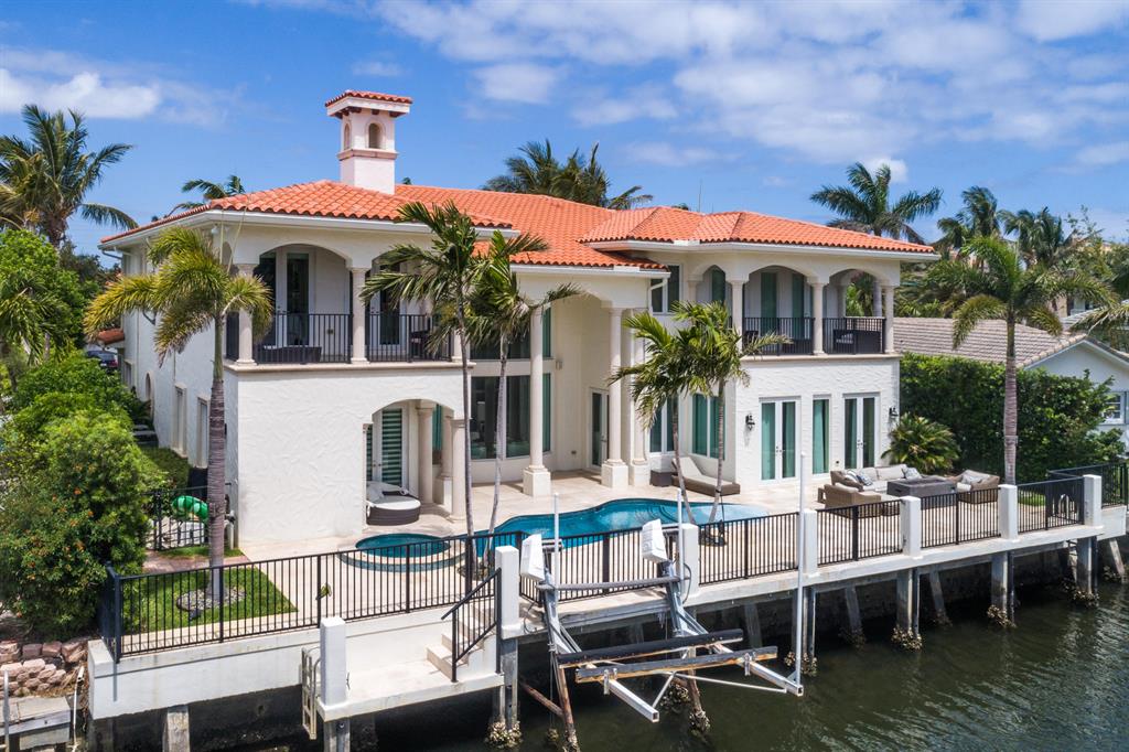 Enjoy Boca Style Waterfront Living in this Magnificent Turnkey Home.If you've always dreamed of living the Boca Raton lifestyle and wanted to combine your passions for boating and entertaining, this home is perfect for you. With over 5100 SF of living space, this 5-BR/6.5-BA dream home has it all. From the moment you walk through the arched entryway and step onto the gleaming marble floor of the foyer, you know you're experiencing luxury. The beautiful marble pillars on either side of the entry to the living room are but a hint of the elegance that is evident in every room of this home. The living room provides soaring views of the upper balcony and through the gorgeous large glass doors you can see the covered patio and glimmering waters of the pool.