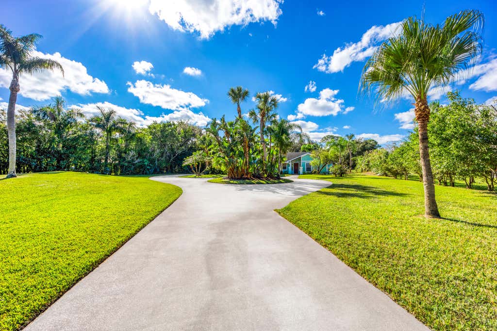Photo of 2232 SW RACQUET CLUB Drive, Palm City, FL 34990 (MLS # B26058431)