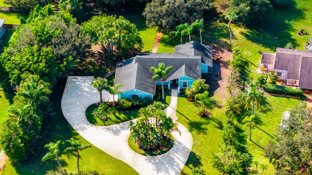 Photo of 2232 SW RACQUET CLUB Drive, Palm City, FL 34990 (MLS # B26058431)