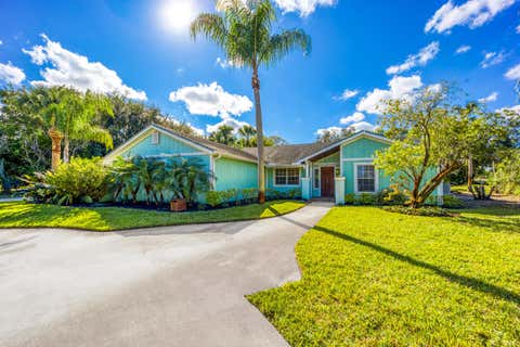 Photo of 2232 SW RACQUET CLUB Drive, Palm City, FL 34990 (MLS # B26058431)