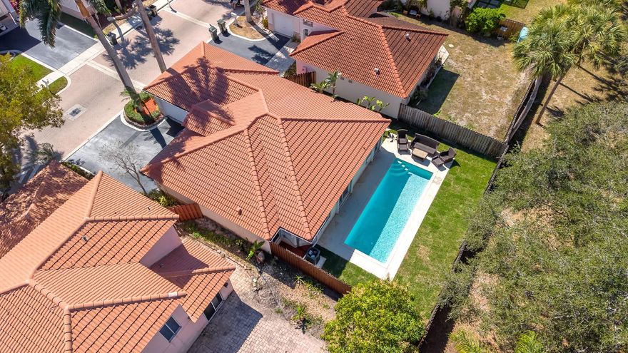 ***Rarely available***  Step outside to your private backyard retreat featuring a spacious patio, generous back & side yards, and of course, a gorgeous sparkling pool completing the perfect space for entertaining friends and family. Fully fenced for privacy and to let the dogs roam. This immaculate single story has perfectly manicured landscaping all around including two stunning palm trees that welcome you at the driveway.  Upgraded kitchen w quartz counter tops!! Master bath completely renovated!!  2025 A/C!!! 2018 Roof!!! Tankless hot water heater! Accordion Shutters!! 2025 pool pump! LOW HOA fee only $97 per month!! Windmill Park within walking distance offers pickleball courts, tennis courts, sand volleyball, basketball courts, kids playground + a dog park!! Short drive to the beach!!