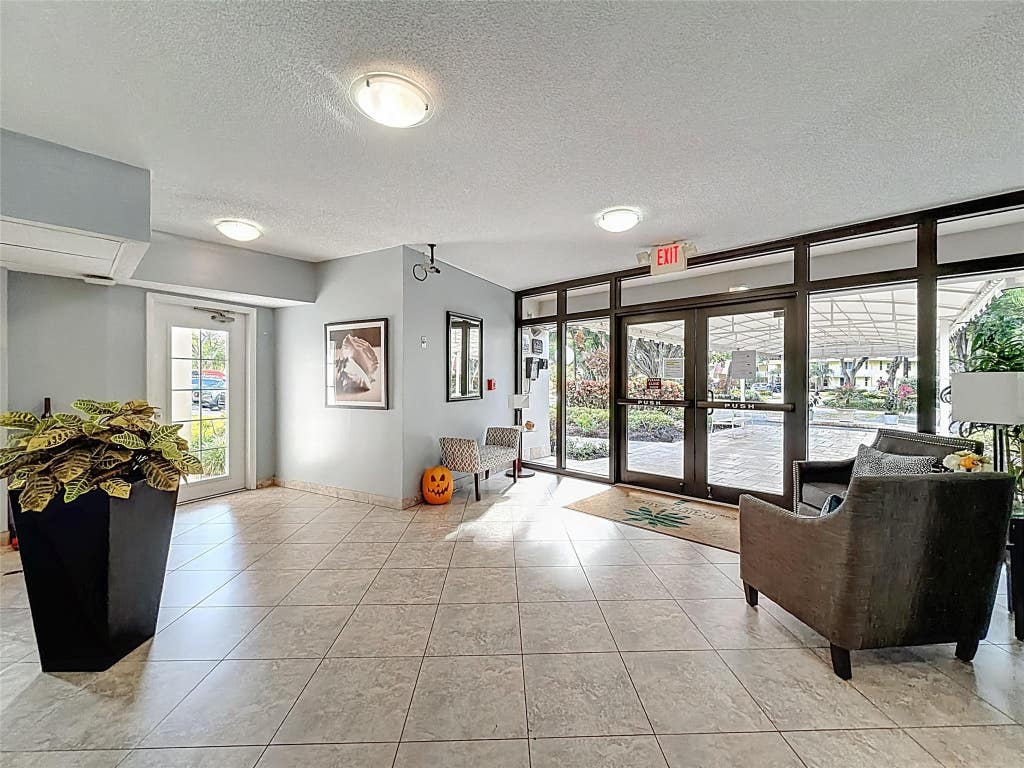 Photo of 545 Oaks Lane #410, Pompano Beach, FL 33069 (MLS # B26066759)