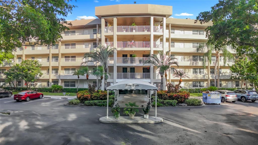 Photo of 545 Oaks Lane #410, Pompano Beach, FL 33069 (MLS # B26066759)