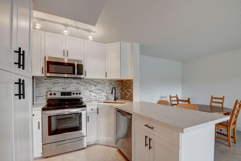 Photo of 629 Sea Pine Way Way #A-1, Green Acres, FL 33415 (MLS # R10809625)