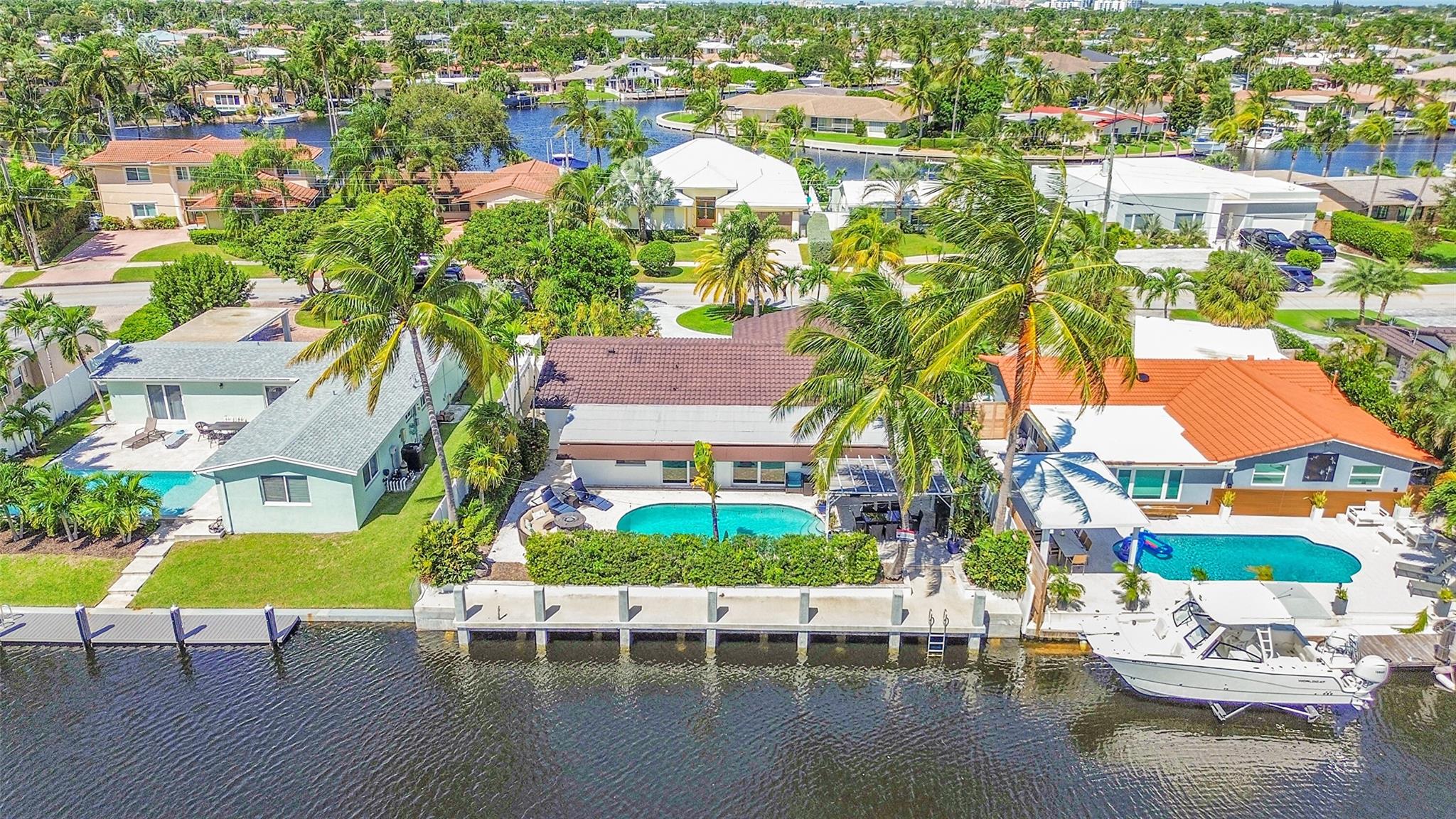 Boater’s paradise in Cypress Lake! This fully furnished, turnkey 4-bed, 2-bath waterfront home with an oversized one car garage offers ocean access with just one fixed bridge at Federal Highway. Featuring a brand-new seawall and concrete dock spanning the property’s length, this home is perfect for boaters. Split floor plan, hurricane impact windows and doors, updated kitchen and bathrooms.  Tropical backyard with a heated saltwater pool. Park your boat in your backyard and embrace the South Florida lifestyle with easy access to the intracoastal and ocean!