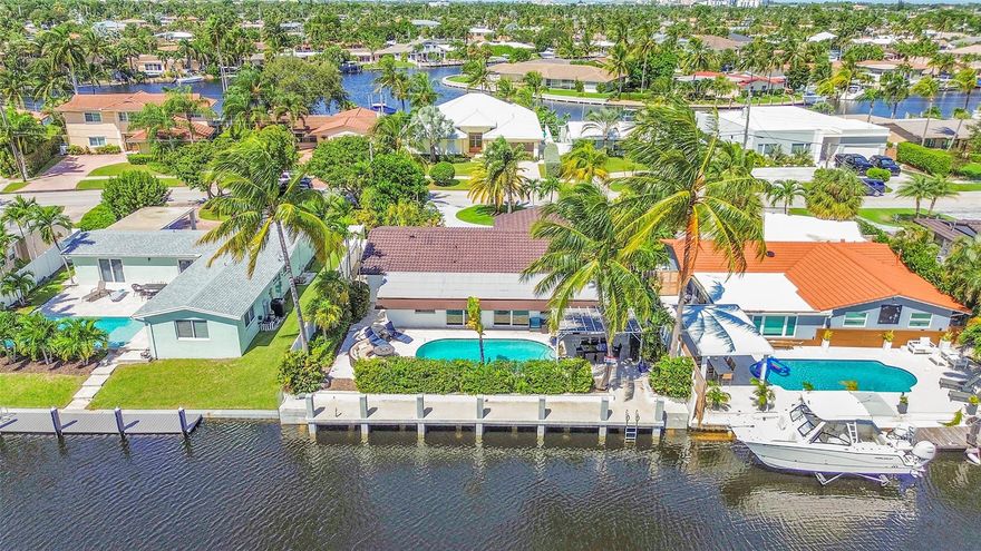 Boater’s paradise in Cypress Lake! This fully furnished, turnkey 4-bed, 2-bath waterfront home with an oversized one car garage offers ocean access with just one fixed bridge at Federal Highway. Featuring a brand-new seawall and concrete dock spanning the property’s length, this home is perfect for boaters. Split floor plan, hurricane impact windows and doors, updated kitchen and bathrooms.  Tropical backyard with a heated saltwater pool. Park your boat in your backyard and embrace the South Florida lifestyle with easy access to the intracoastal and ocean!
