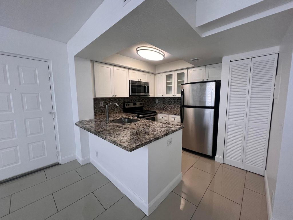 Photo of 728 Executive Center Drive #11, West Palm Beach, FL 33401 (MLS # B26032350)