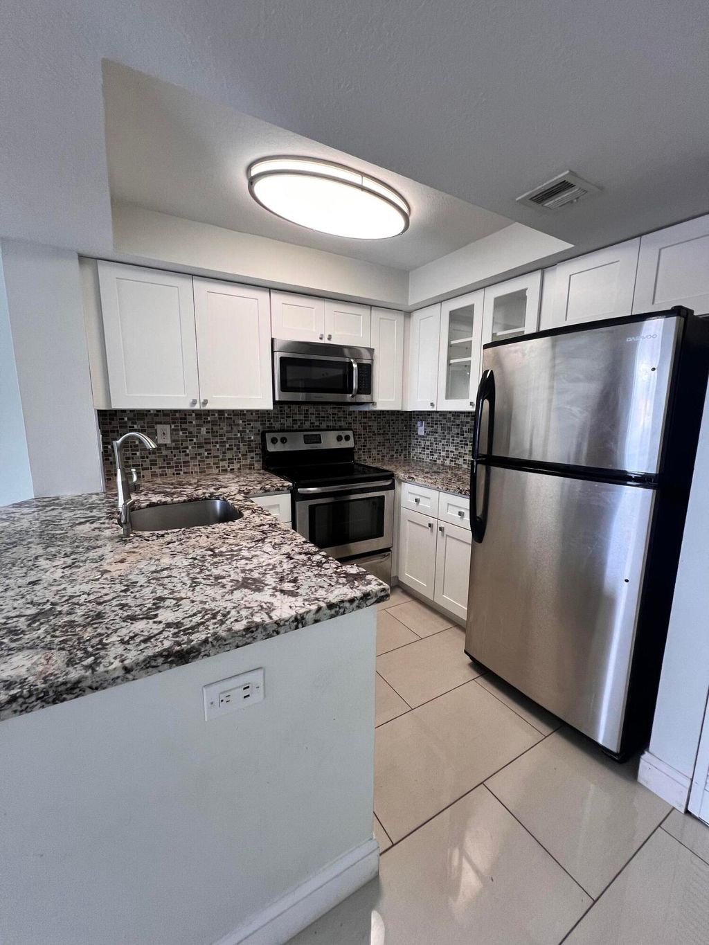 Photo of 728 Executive Center Drive #11, West Palm Beach, FL 33401 (MLS # B26032350)