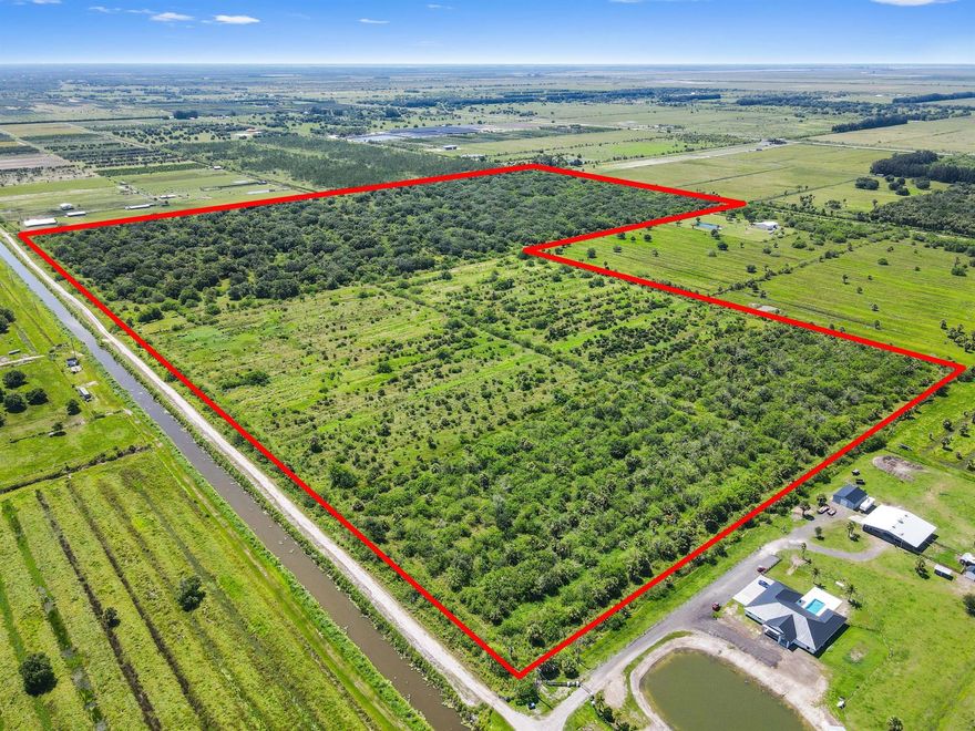 Prepare to realize your grandest vision on this remarkable 114.85-acre agricultural lot, a truly unique opportunity nestled within a quiet and serene neighborhood inFort Pierce. This expansive parcel offers the rare chance  exceptional 114-acre plot of land in the serene countryside of Fort Pierce, Florida. This prime piece of real estate offers endless possibilities, whether you're looking to develop, farm, or create a private equestrian estate. Currently zoned AG5, this versatile property is situated just steps to Orange Ave.  Surrounded by nature and unparalleled privacy. Imagine a sprawling estate, a family compound, or a private retreat - the possibilities are truly limitless on this vast canvas.