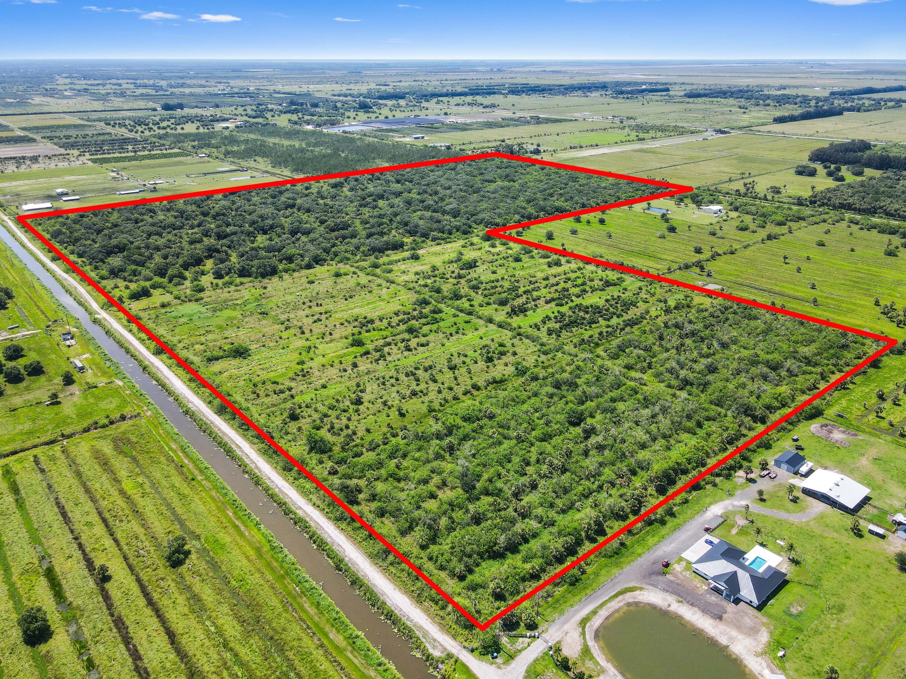 Prepare to realize your grandest vision on this remarkable 114.85-acre agricultural lot, a truly unique opportunity nestled within a quiet and serene neighborhood at Fort Pierce. This expansive parcel offers the rare chance to start completely from scratch, giving you the ultimate freedom to design and build the custom dream home you've always envisioned, surrounded by nature and unparalleled privacy. Imagine a sprawling estate, a family compound, or a private retreat - the possibilities are truly limitless on this vast canvas.