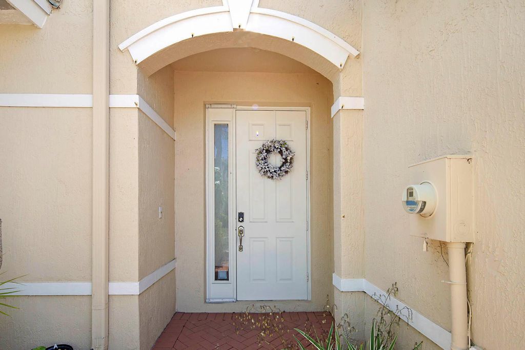 Photo of 6147 Seminole Gardens Circle, Riviera Beach, FL 33418 (MLS # R11106606)