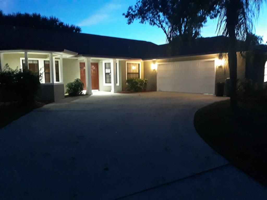 Photo of 4451 NW Alsace Avenue, Port Saint Lucie, FL 34953 (MLS # R10757145)