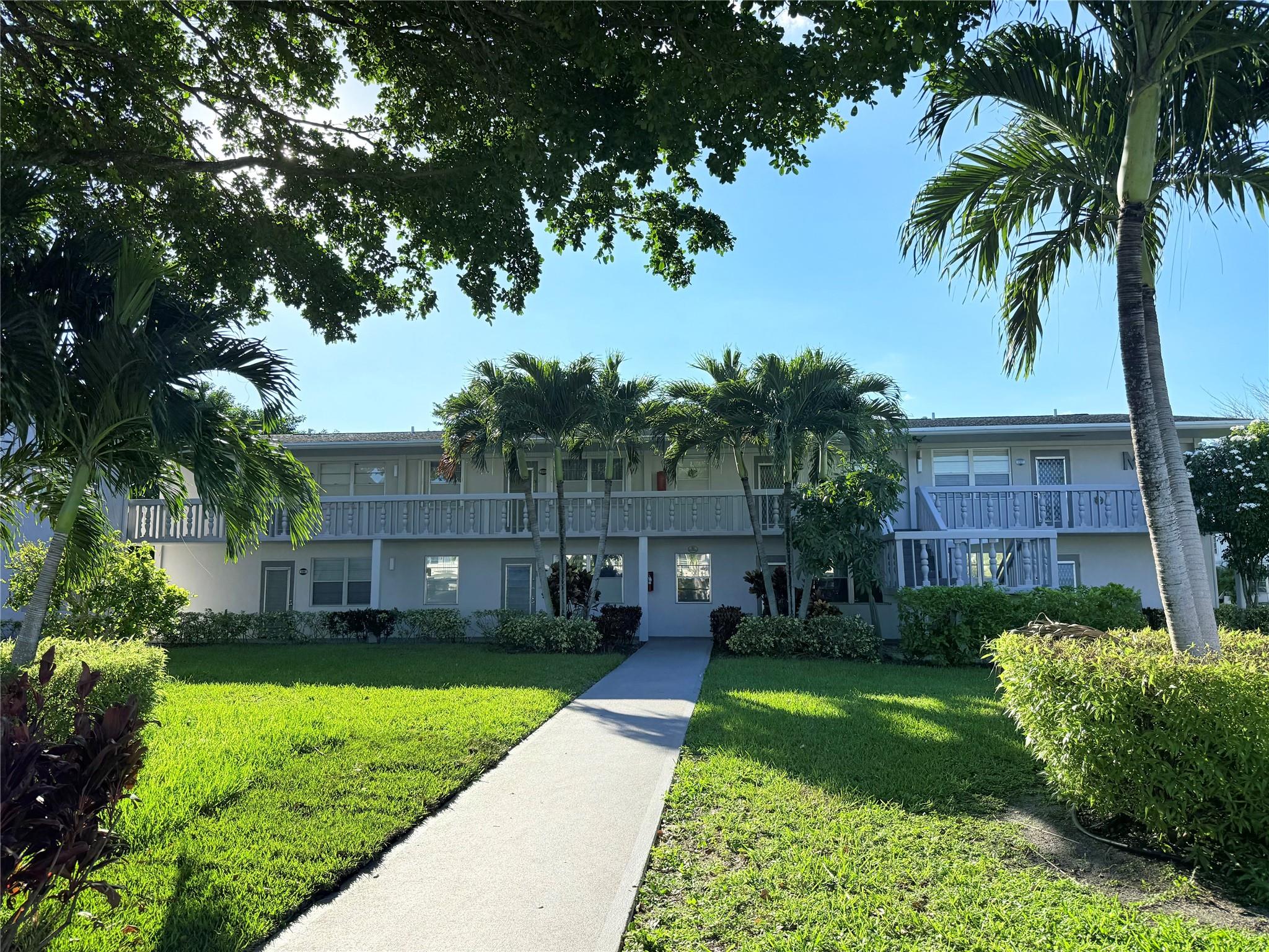 BRIGHT & VERY WELL MAINTAINED 1 bed, 1.5 bath CORNER unit on the 2nd floor with garden views from the living room. Sold TURNKEY FURNISHED, featuring wood-look laminate floors, updated kitchen, and water heater (2022). Very large bedroom with a wall of closets and a Florida room with ROLL-DOWN SHUTTERS. Located in a well-kept building on a PEACEFUL CUL-DE-SAC with serene WATER VIEWS FROM BBQ & PICNIC AREA. 
This vibrant 55+ community offers heated pools, tennis, pickleball, billiards, ping pong, mini golf, clubhouse, live shows, art classes, fitness center, and more. Minutes to shops, restaurants, highways, and beautiful beaches—ideal for year-round living or a relaxing getaway.