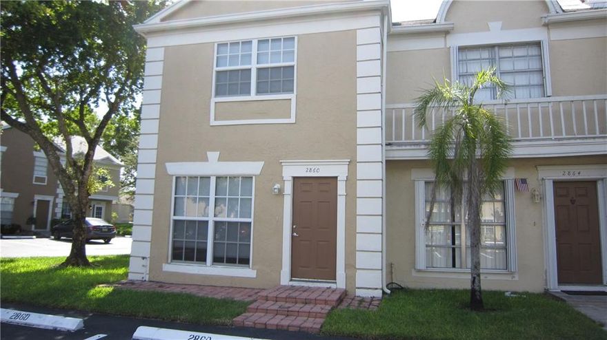 Move right in.  Beautiful updated corner unit with new kitchen, bathrooms, impact windows, A/C system all completed within the last 3 years.  Excellent Cooper City location in well maintained Fee Simple HOA townhouse complex - Crown Colony/Rock Creek.
