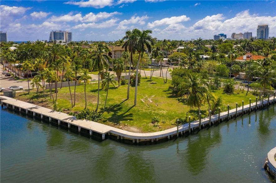 Build your dream home here!! Interior point lot with 325' of water frontage on Sunset Lake. NEWER SEAWALL & DOCK! Wide water views, located in a gated community on the S side of Las Olas with quick and easy ocean access. Easy walk or bike ride to Fort Lauderdale Beach, fine dining and nightlife!