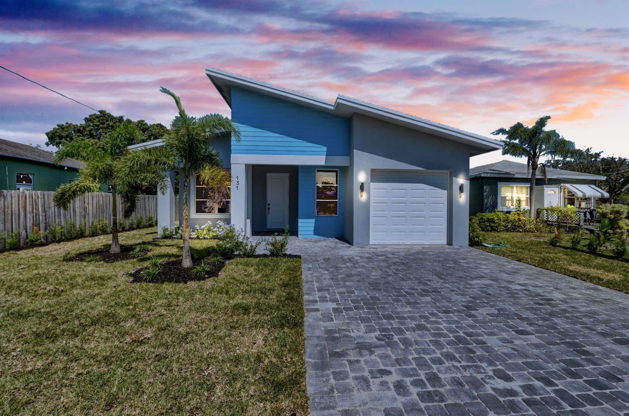Perfectly situated to meet the needs of your unique lifestyle and personality, this modern, spacious home offers premium access to everything Delray Beach has to offer. Whether you're dining out, catching a concert, doing a little boutique retail browsing, or just heading to work, you're never more than a few minutes from home when you this East Delray home.You'll experience the elevated lifestyle that comes along with a private fenced in yard, covered patio and a spacious layout with elegant 9ft ceilings. The open floorplan featuring an island kitchen with quartz countertops, stainless steel appliances, and modern luxury finishes is everything you want in a home.
