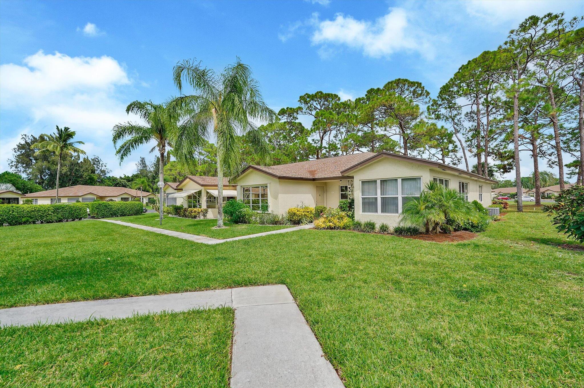 This immaculate 55+ villa is being offered both seasonally and annually. Seasonal rental is available for a minimum of 4 months. This unit features a large one bedroom but also has a Florida room which could be utilized as an office/den. Upgrades throughout the unit including kitchen cabinetry, granite counter-tops, stainless steel appliances, LED lighting, and a beautiful backsplash. The bathroom features Silestone counter-tops, glass doors, sinks and fixtures. There is plenty of bedroom storage featuring two walk in closets. In addition there is wall and linen closet. Enjoy the stackable washer/dryer and upgraded window treatments. This unit is perfect for the person who wants to enjoy the Florida weather and escape the cold.
