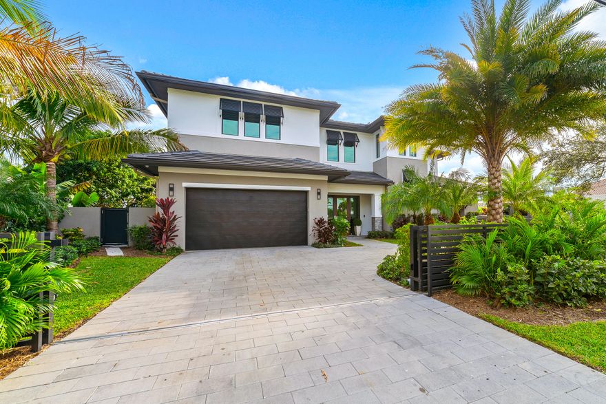 This spectacular New & Modern Home (2021 c/o) located in Bel-Marra, a highly sought-after waterfront community, offers stunning design finishes throughout and a true waterfront PARADISE! Entering the home, you are sure to be captivated by breathtaking water views. Featuring 5 bedrooms and 5 baths, you will revel in an impressively large and open kitchen with spacious dining and living room spaces. You'll enjoy a large bonus room that can double as a bedroom, media room, or game room with an incredible wet bar and ample storage. Also, enjoy a full bedroom/bathroom great for guests on the main level and an additional pool half bathroom. Outside you'll love the ultimate patio with a large salt-water pool & spa. It continues as you walk to your 80-foot dock which has an additional twin jet-ski dock. On the second floor, escape to your unbelievable Primary Suite with floor-to-ceiling windows, walk-in closets with custom built-ins, and a fabulous spa-inspired bathroom featuring dual water closets, dual showers, and a large freestanding soaking tub. Two additional bedrooms with ensuites, an additional family/flex room with a balcony complete the fabulous second floor. Two laundry rooms ensure ease of living (1st & 2nd floor) and Control4 whole-home audio & video security technology. You're sure to be impressed by the exquisite materials and recent upgrades: high impact rated windows and doors, elevator, whole home generator, outdoor kitchen, professional lushly landscaping w/up lighting, automatic front security fence, and wireless blinds. Conveniently located close to Boca Inlet, providing open ocean access in no time at all. Wholefoods, Trader Joe's, Mizner Park, and Spanish River Beach are just around the corner, and minutes away from I-95! The home can be purchased, turnkey, with all luxury/designer furnishings as well. With this exquisite home, you get the luxury of brand-new construction but the added bonus of ample upgrades that require no additional waiting of contractors or expenses. It is ready to enjoy the Florida sun and lifestyle, turnkey today!