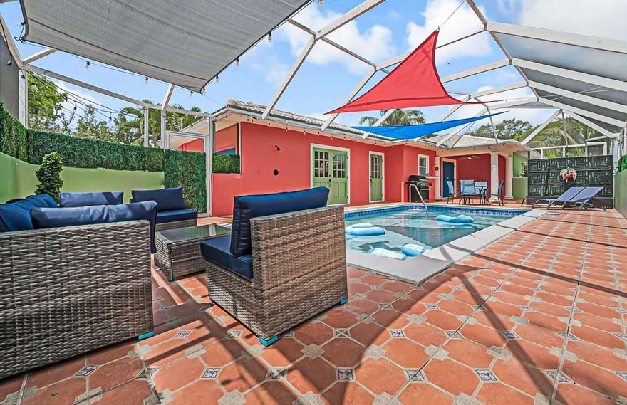 SEASONAL MONTHLY Rental!! Welcome to Sun Sail Retreat ☀️🌴 Located in the heart of Lake Worth Beach, this vibrant 3BR/2BA home features a screened-in pool with colorful sail shades, a fun garage game room, and lush fenced yard. Just minutes to the beach and downtown, it's your private slice of paradise -- or a sunny getaway for all age groups! It boasts of beautifully designed retreat featuring a stunning lighted swimming pool -- perfect for evening swims or romantic nights under the stars.