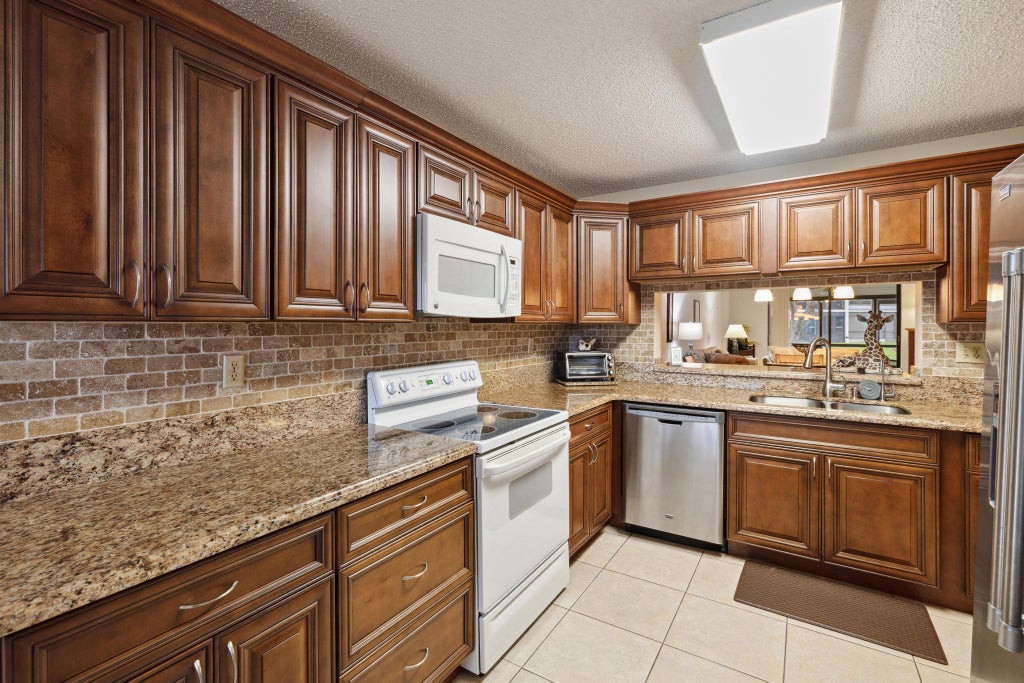 Photo of 15456 Pembridge Drive #101, Delray Beach, FL 33484 (MLS # R10917471)