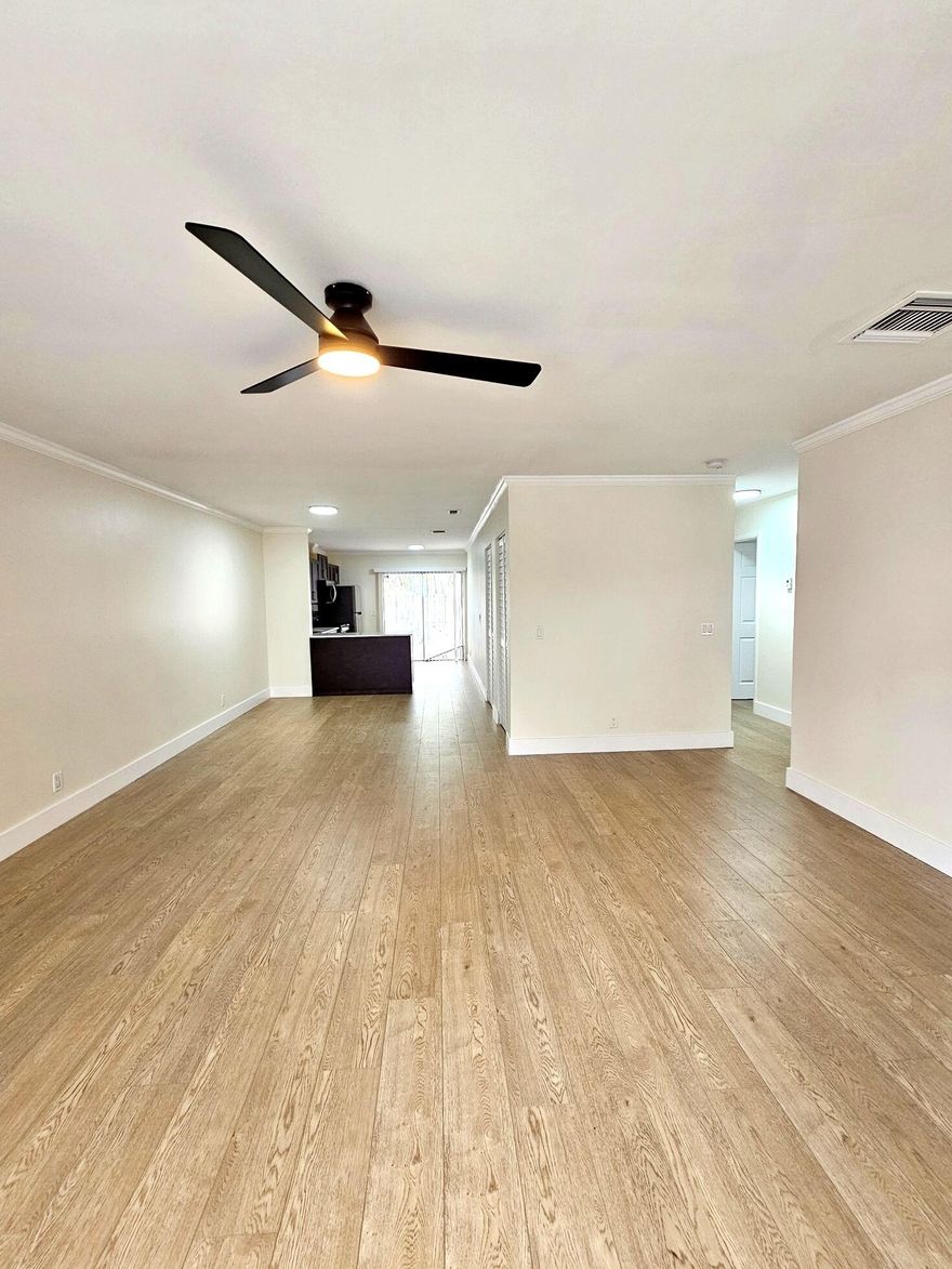 COMPLETELY RENOVATED and freshly painted 3-bedroom, 2-bathroom townhouse offering 1,320 SqFt of living space! This unit is in EXCELLENT condition and features a BRAND NEW kitchen with modern cabinetry, granite countertops, and brand new stainless steel appliances. Both bathrooms have been fully renovated with contemporary finishes. The home also includes brand new laminate flooring throughout and decorative ceiling fans, creating a clean and modern living environment. Enjoy the convenience of a full-size washer and dryer in the unit. Ideally located just minutes from the Turnpike, I-95, and downtown, providing easy access to major highways, shopping, dining, and entertainment. A perfect combination of comfort, style, and location — don't miss this opportunity!