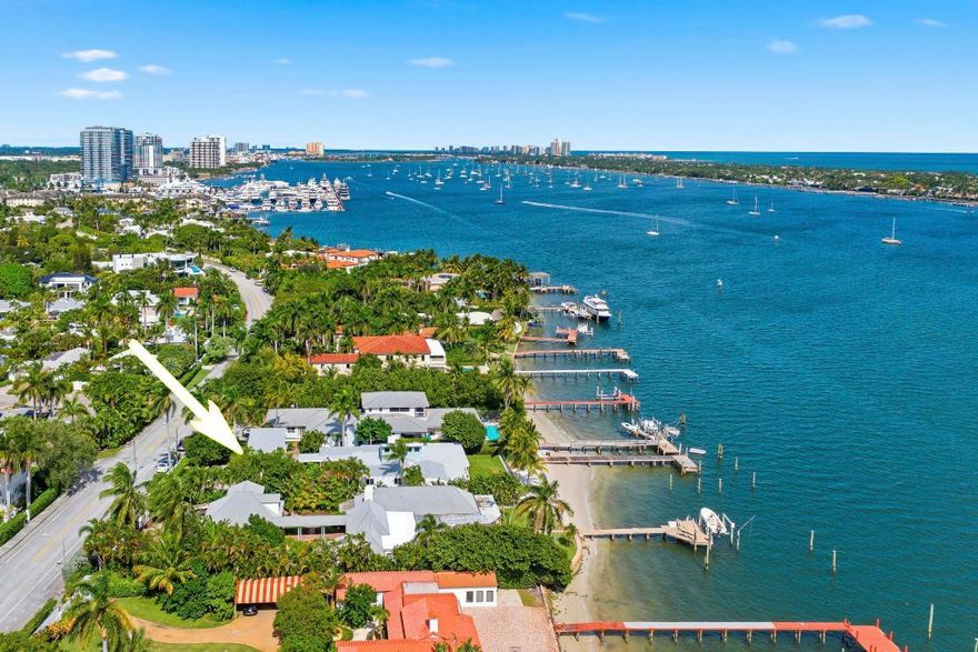 Direct Intracoastal.  Freshly renovated 5 bedroom/4 bath pool home with guest house, two car garage, dock, impact windows, and a new roof (2025) . Experience amazing Intracoastal and Palm Beach views from all major rooms in this fabulous single story home with vaulted ceilings in the living room, and an eat-In kitchen and family room with Intracoastal views ... Watch the yachts floating by on the way to the Palm Beach Inlet just minutes away.  With a private  beach, all situated on a 17,498 sq. ft. Lot.  It's just perfect and Truly a Rare Find! Move in and Enjoy!