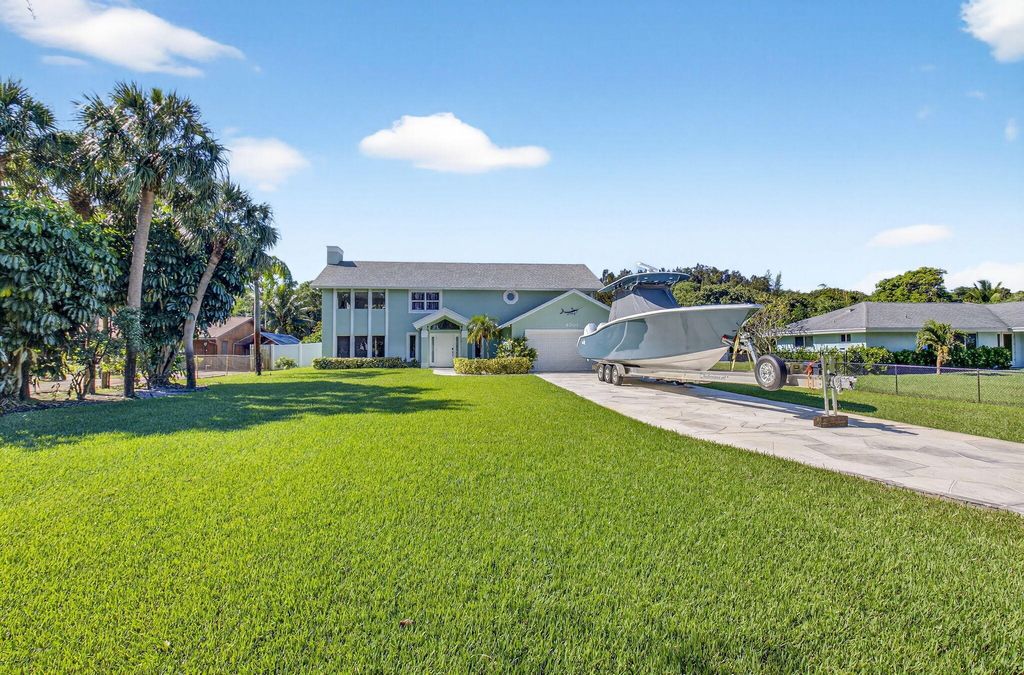 Photo of 6701 Hillside Lane, Lake Worth, FL 33462 (MLS # B26026059)