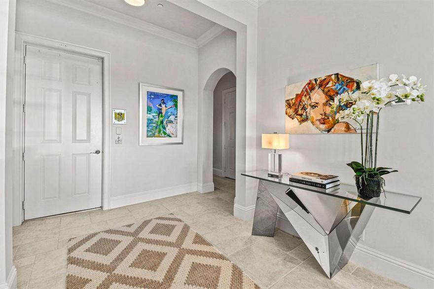 Within the exclusive gated community of Frenchman's Harbour is a modern coastal carriage home with direct and unobstructed intracoastal views from this third-floor residence. This prestigious community is a boater's dream that comes with a deeded boat slip that hosts up to a 60'' vessel. Upon entering this grand residence is a private elevator (staircase also an option) opens into the foyer to present a split open floor plan with 3 bedrooms and 2 bathrooms. This luxurious condominium has the feeling of a single-family home which encompasses the entire third floor and has gone through a complete renovation. Upgrades which include luxury baseboard and crown moulding, decorative light fixtures, and electric shading to cover the windows.